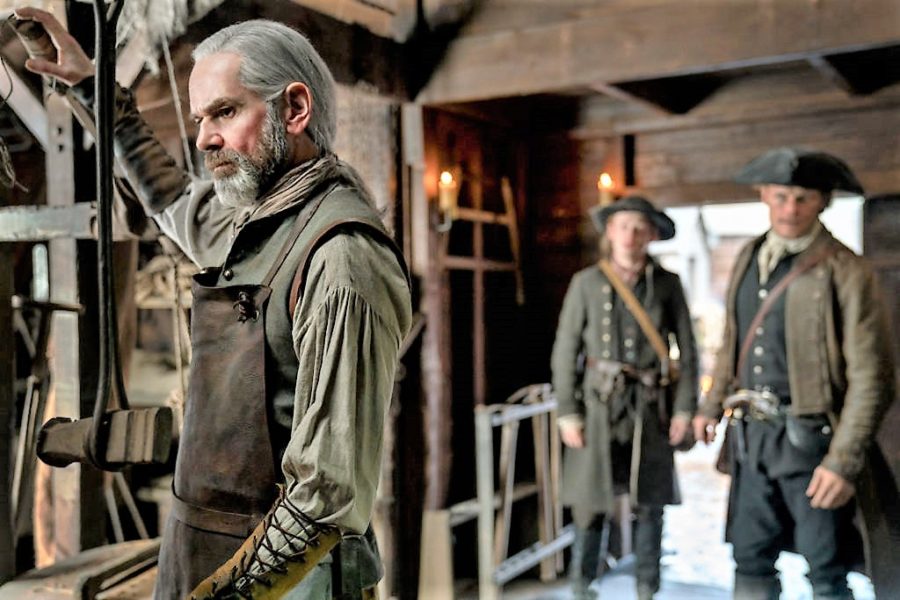 top 10 musical moments in outlander season 4, murtagh and jamie reunion in blacksmith shop