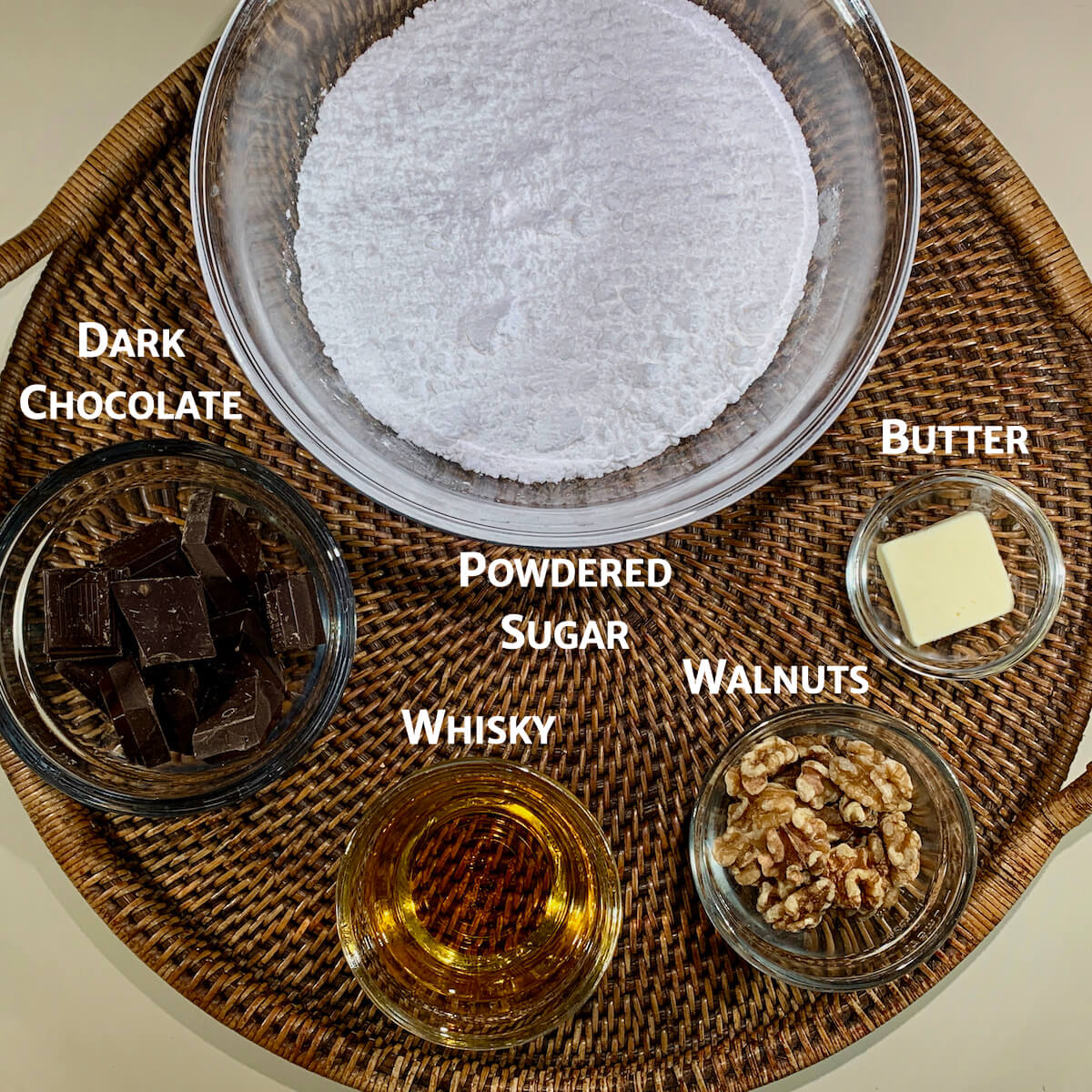 Dark Chocolate Whisky Fudge ingredients with nuts on tray from overhead