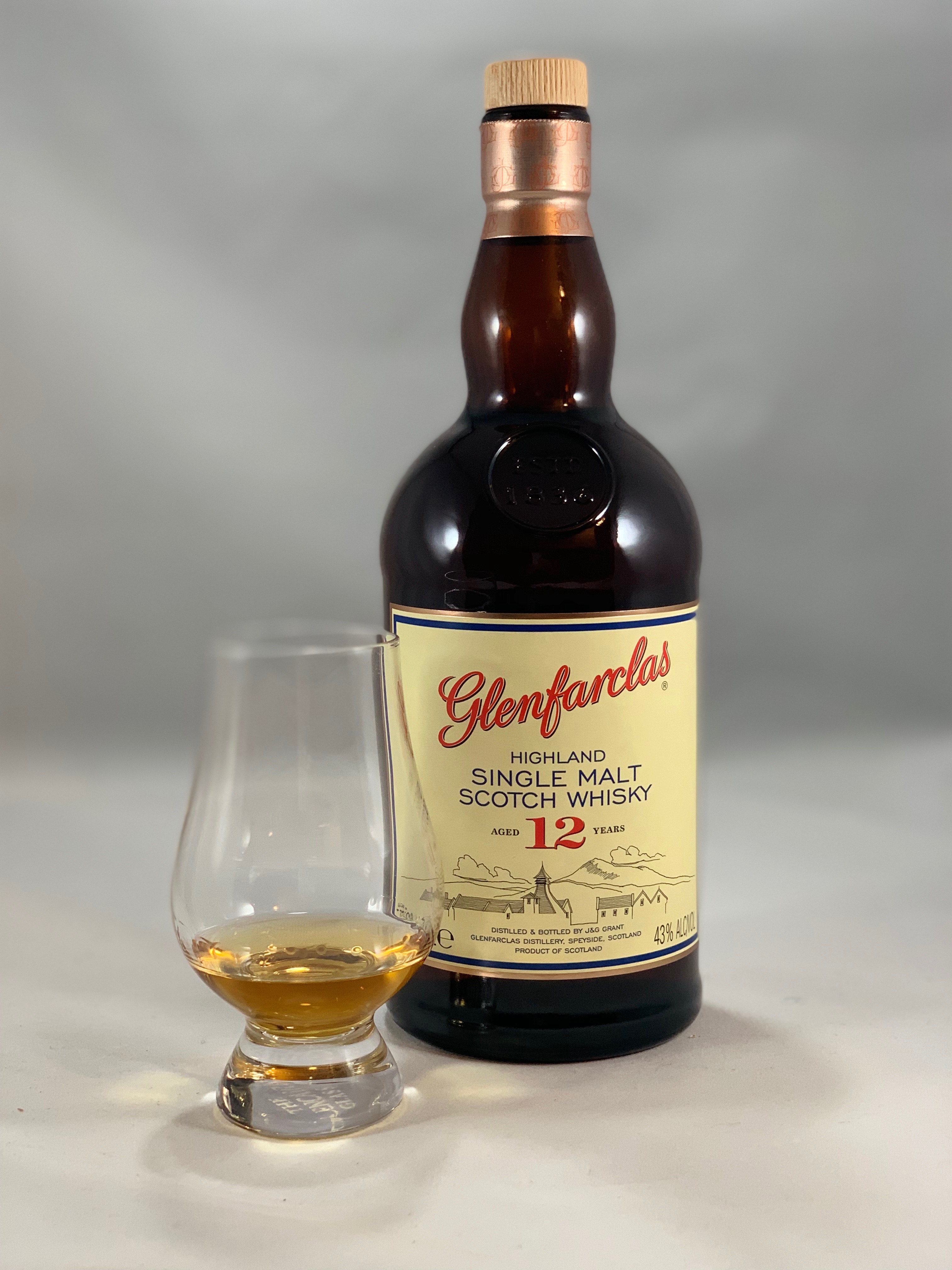 Glenfarclas 12yr in bottle with pour in glass