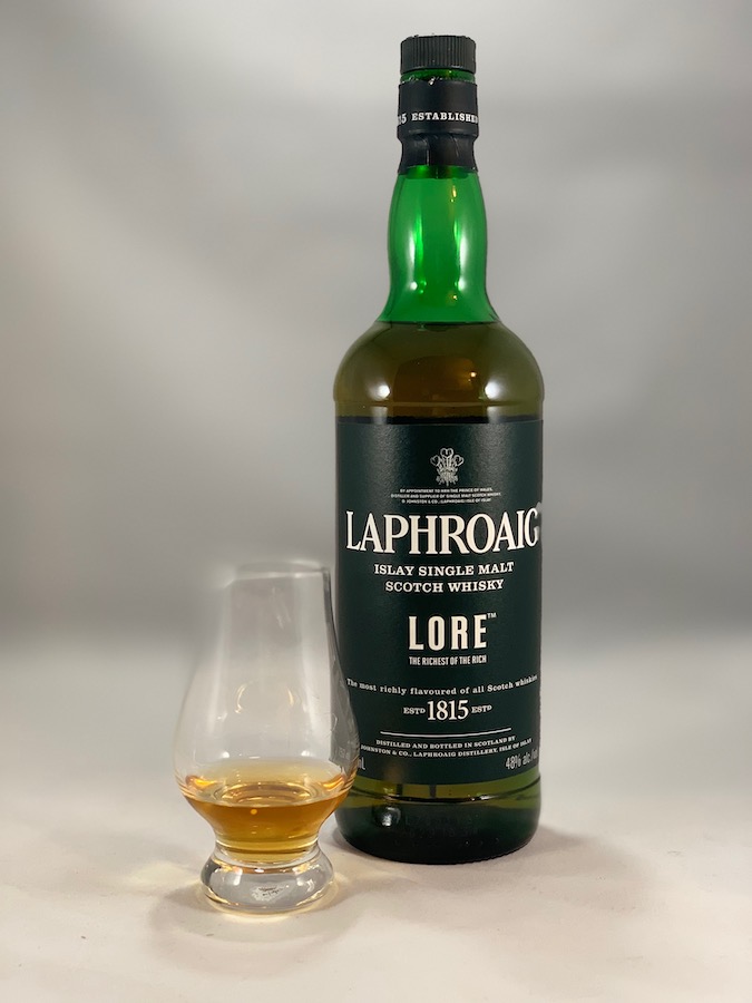 Laphroaig Lore in bottle with pour in glass