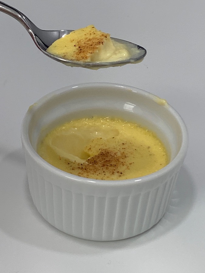 Spoonful of egg custard over the individual serving