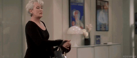 Meryl Streep as Miranda Priestly throwing down her back ad coat.