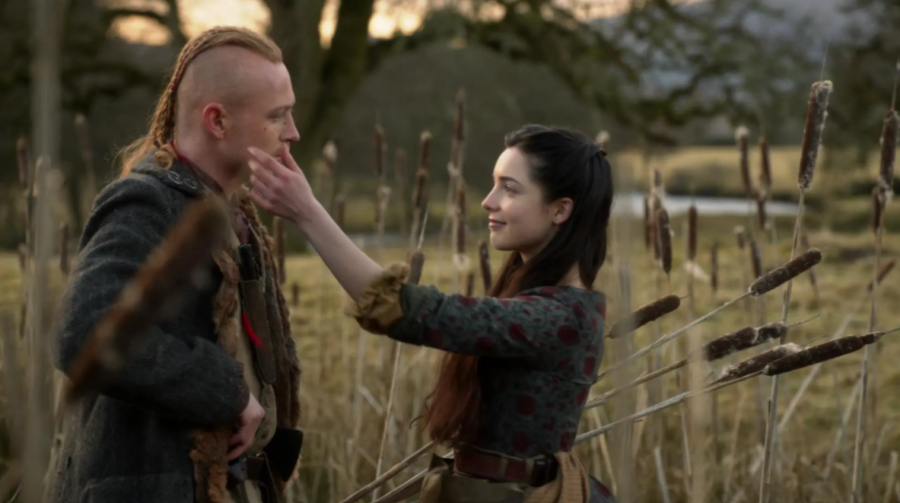 Malva and Ian chatting in a field