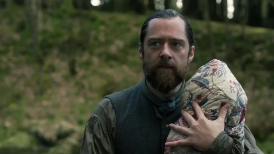 Roger clutching Henri-Christian after saving from the river rapids