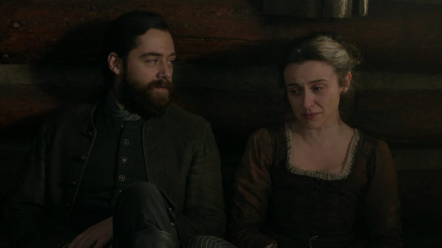 Roger sits close next to Mistress McCallum on the floor. 